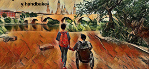 Miguel con su silla de ruedas y Eva paseando al atardecer por el río Ebro
