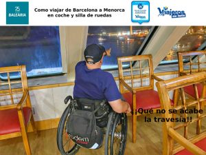 Miguel con su silla de ruedas a bordo del ferry de Baleària mirando por la ventana