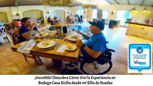 Miguel en su silla de ruedas con Eva, comiendo en el restaurante de la bodega